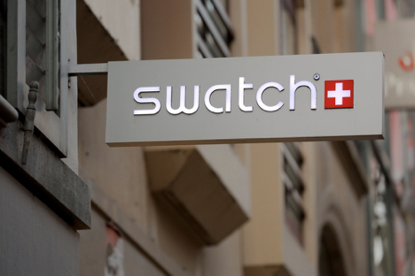 An image of the hanging Swatch sign outside the store.