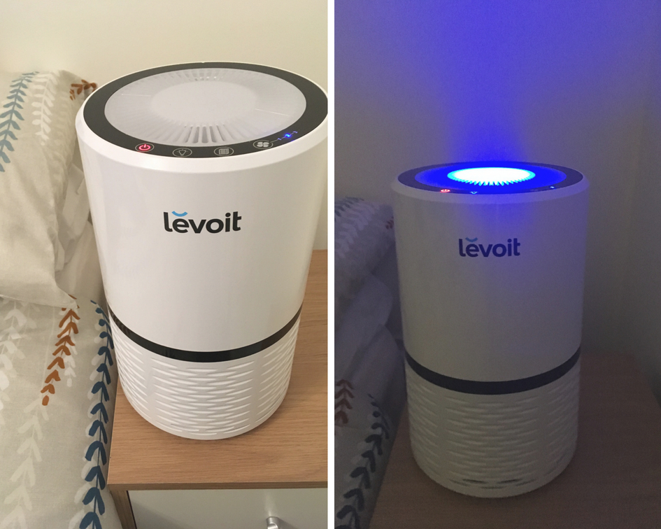 Two photos of the air purifier on my bedside table showing it in the daylight and at night with the lights off and the nightlight-style illumination the purifier has that can be switched on or off.