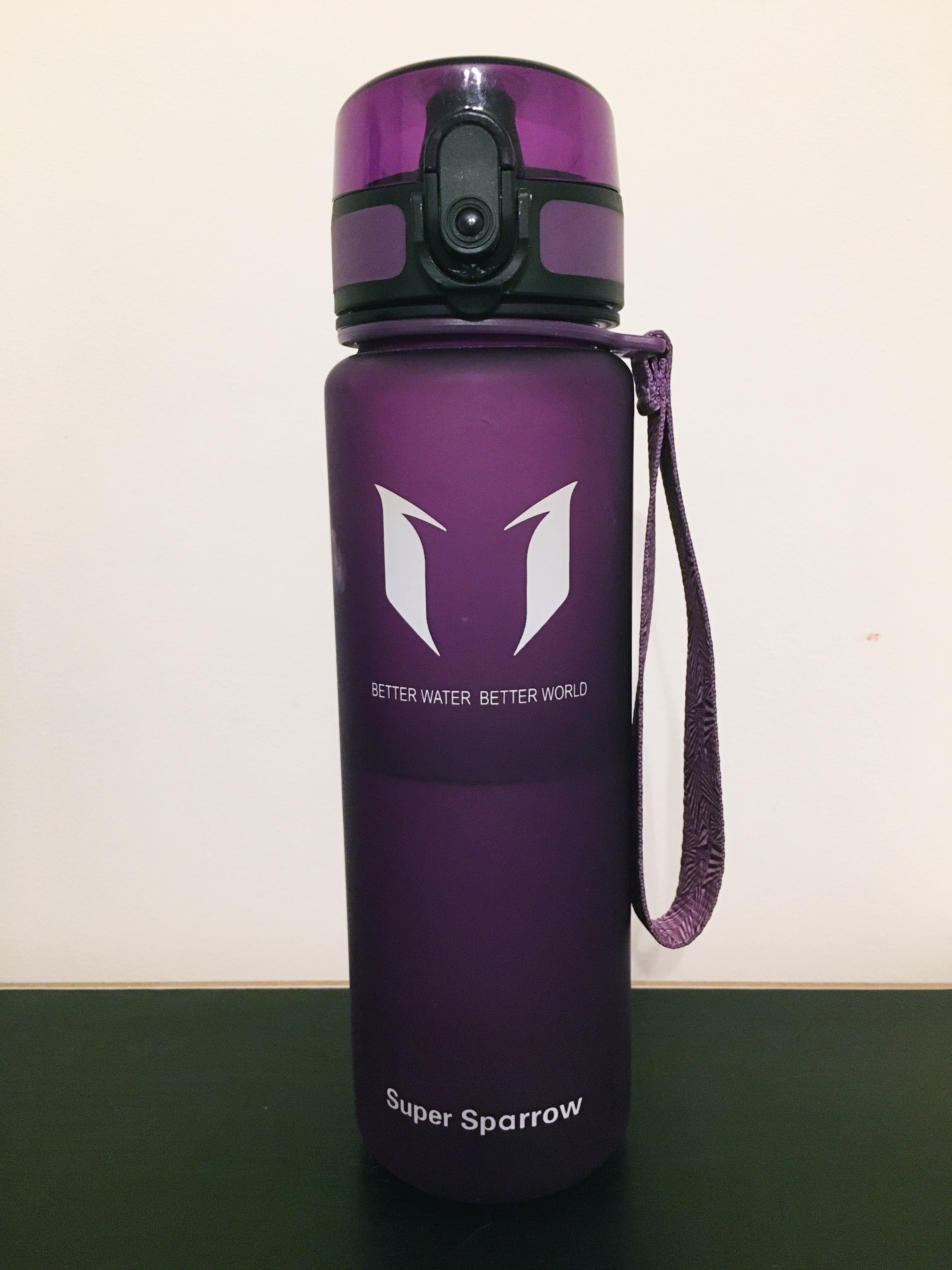 A photo of my purple SuperSparrow water bottle.