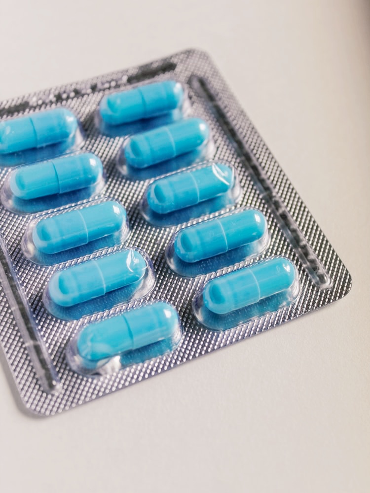 A photo of a blister pack of blue pills.