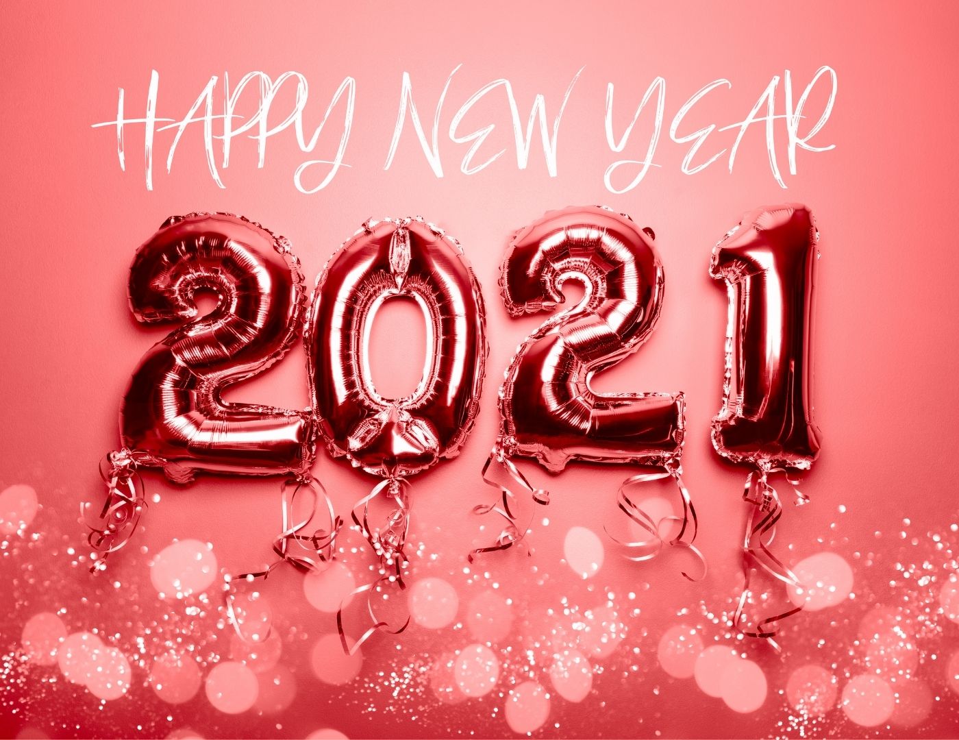 A peach coloured background with numbered balloons in the form of '2021'. Above it reads: Happy New Year. Below is glitter and sparkles.