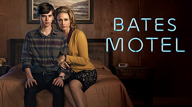 A cover art image promoting the Bates Motel series, showing the show's name in lights like a motel sign to the left, and the two main characters, the mother and son, sat together on the edge of a guest bed.