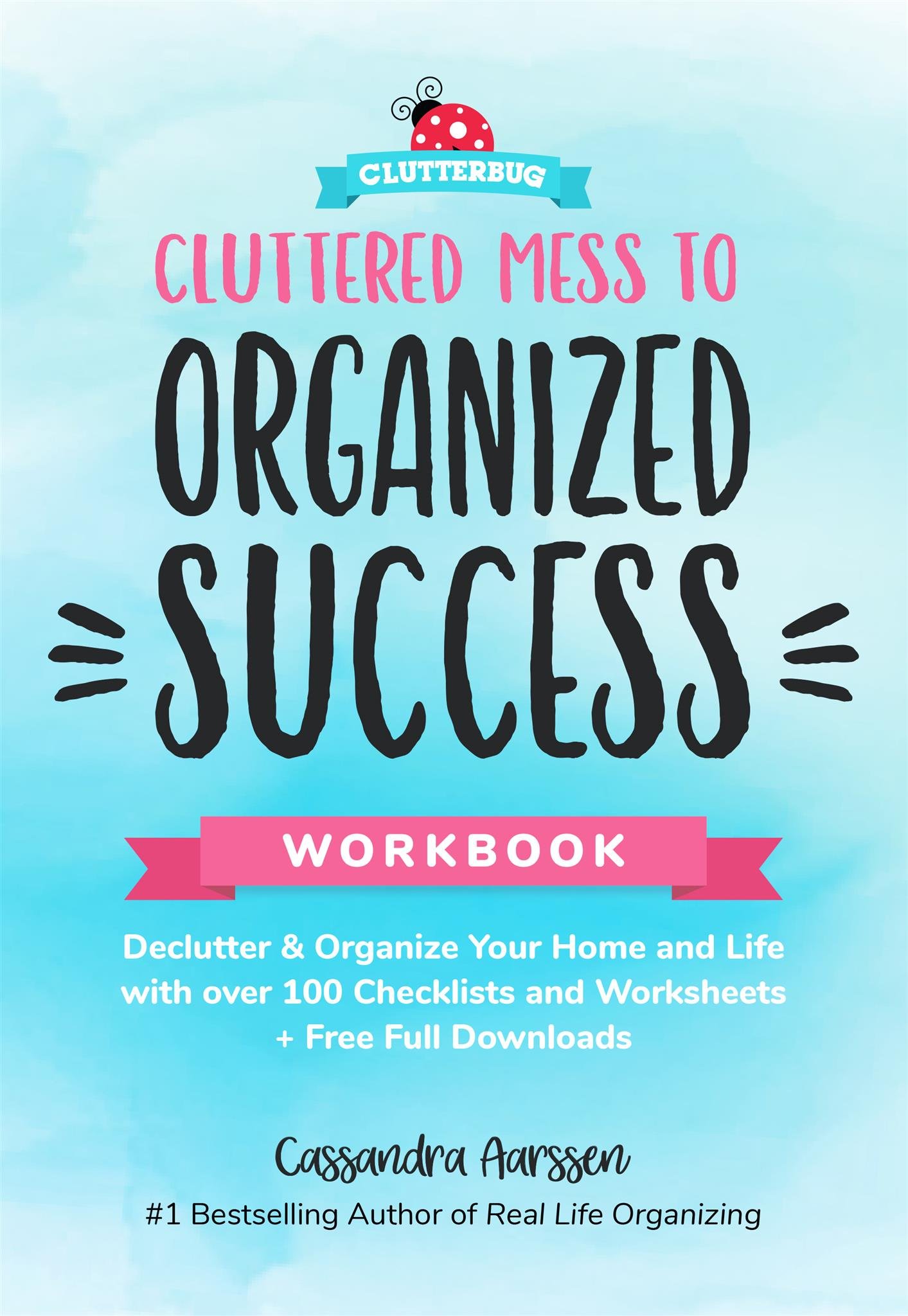 The blue book cover for Cluttered Mess to Organized Success Workbook by Cassandra Aarssen.