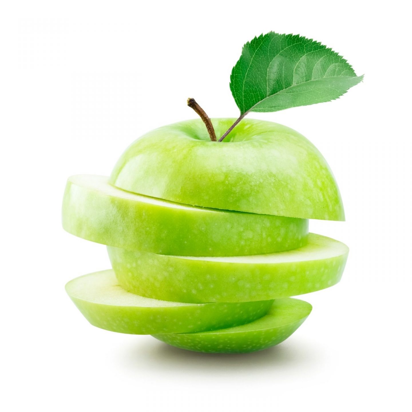 A white background with a single green apple. The apple has been cut into slices and put back together so the slices jut out to either side.