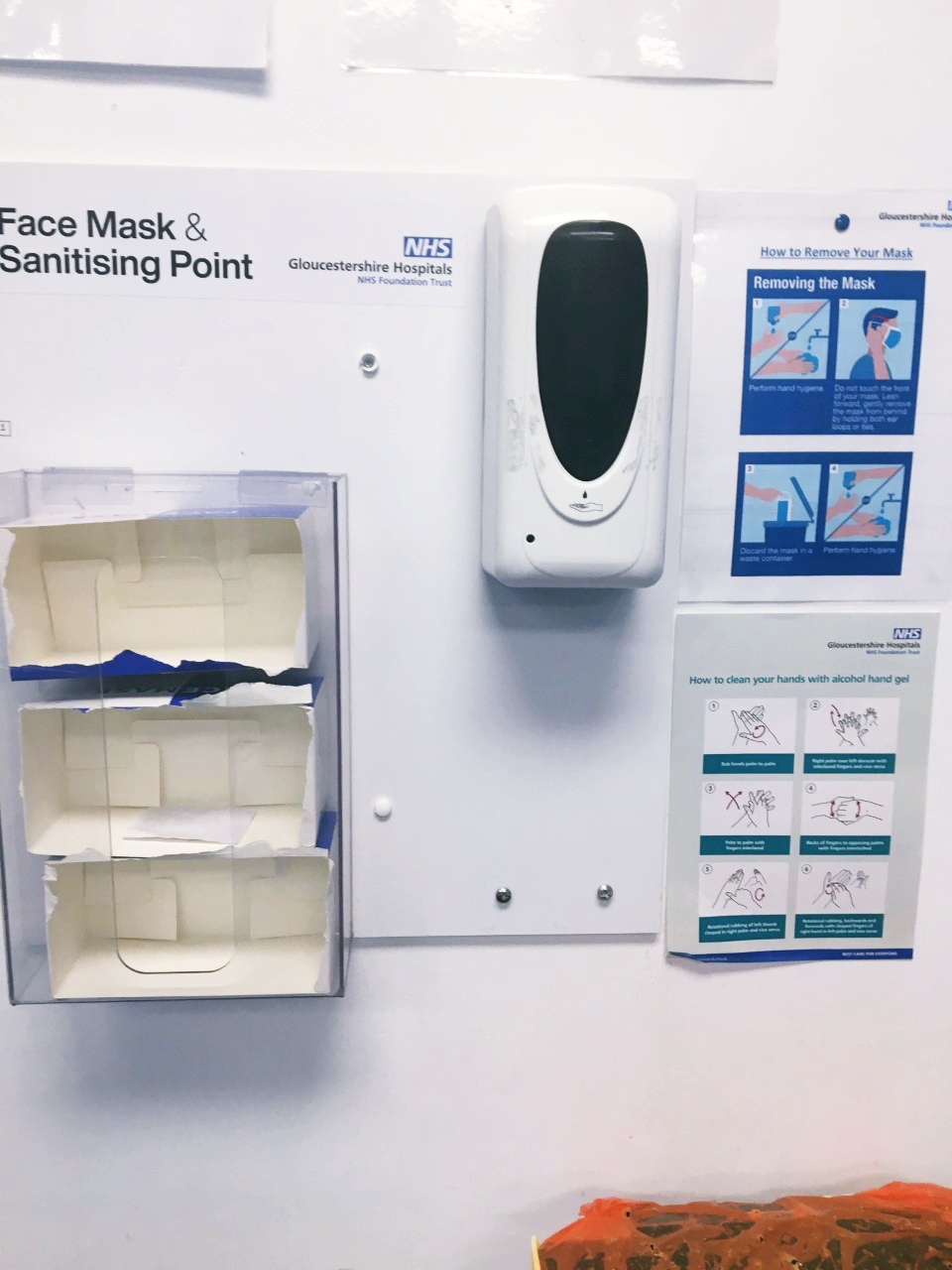A photo of the "face mask and sanitising point" in the hospital, minus any sanitation or face masks.