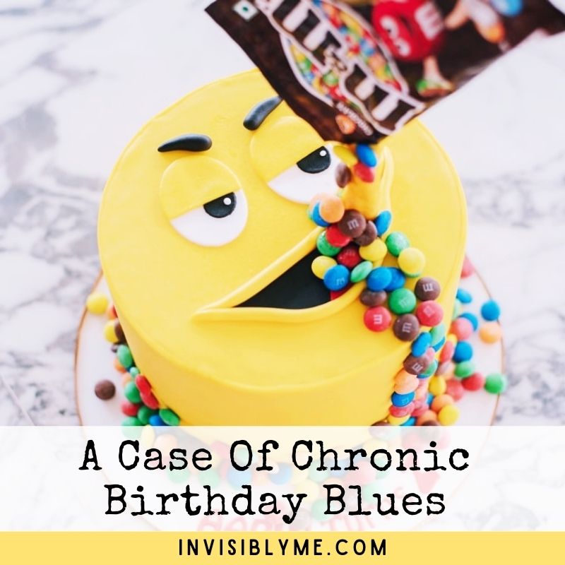 A photo of a large round yellow cake with a mouth and eyes, designed as a grumpy-looking M&Ms character. A bag of M&Ms is above him and lots of the chocolate treats are flowing down into his mouth. Below is the post title: A case of chronic birthday blues.