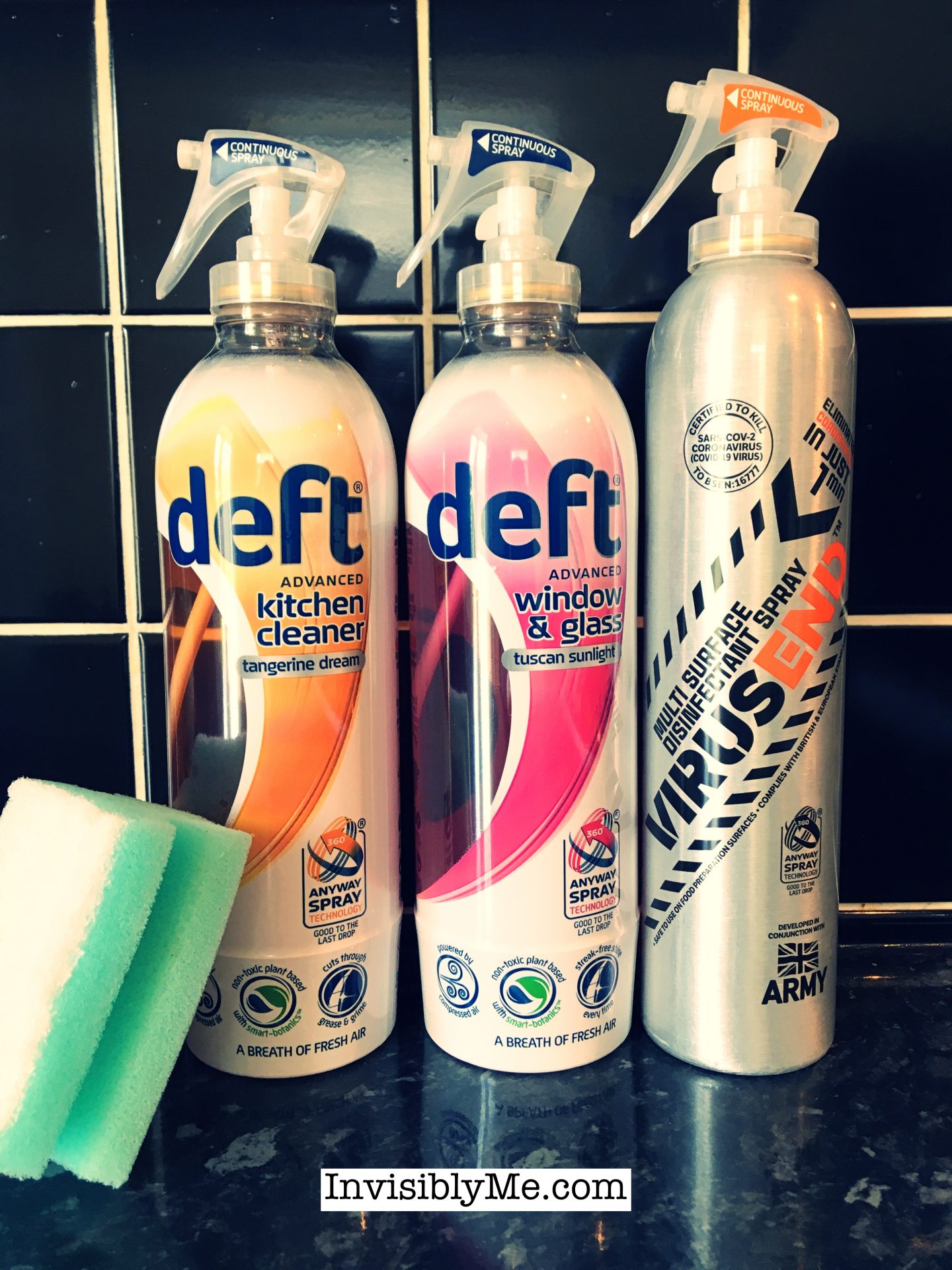 All three bottles - the Virusend, Deft Window and Glass, and Deft Kitchen cleaner, lined up against the black tiles in my kitchen. These are the Deft and Virusend bottles gifted for this review. The colour has been changed so it's slightly darker with an orange tone.