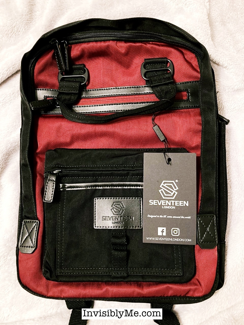 A photo of the Wimbledon backpack from Seventeen London. This is the replacement for the Camden featured in this review. It has a black surround and detailing with a large front pocket, handles and a deep red front. It looks neat and stylish.