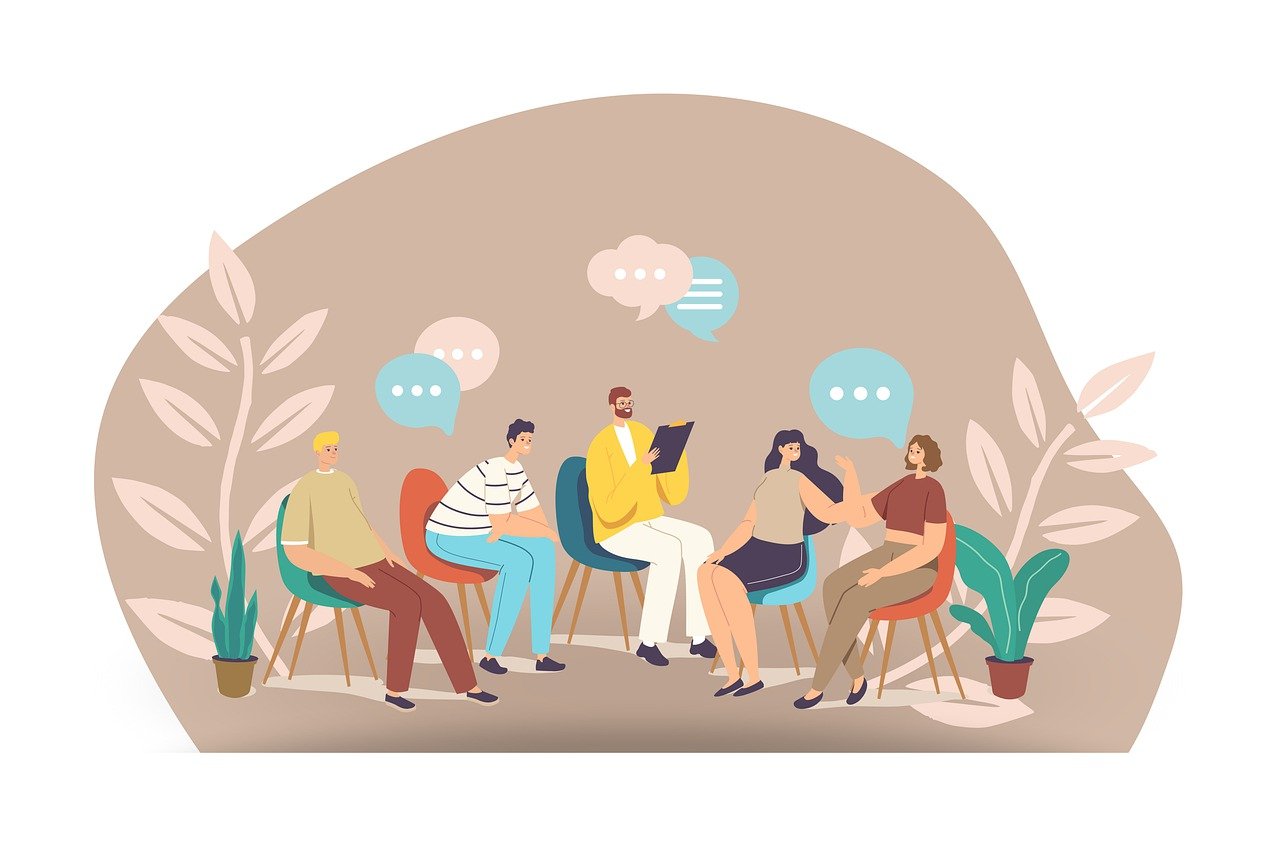 A digital cartoon showing five different people sat around on chairs talking to each other, which speech bubbles above.