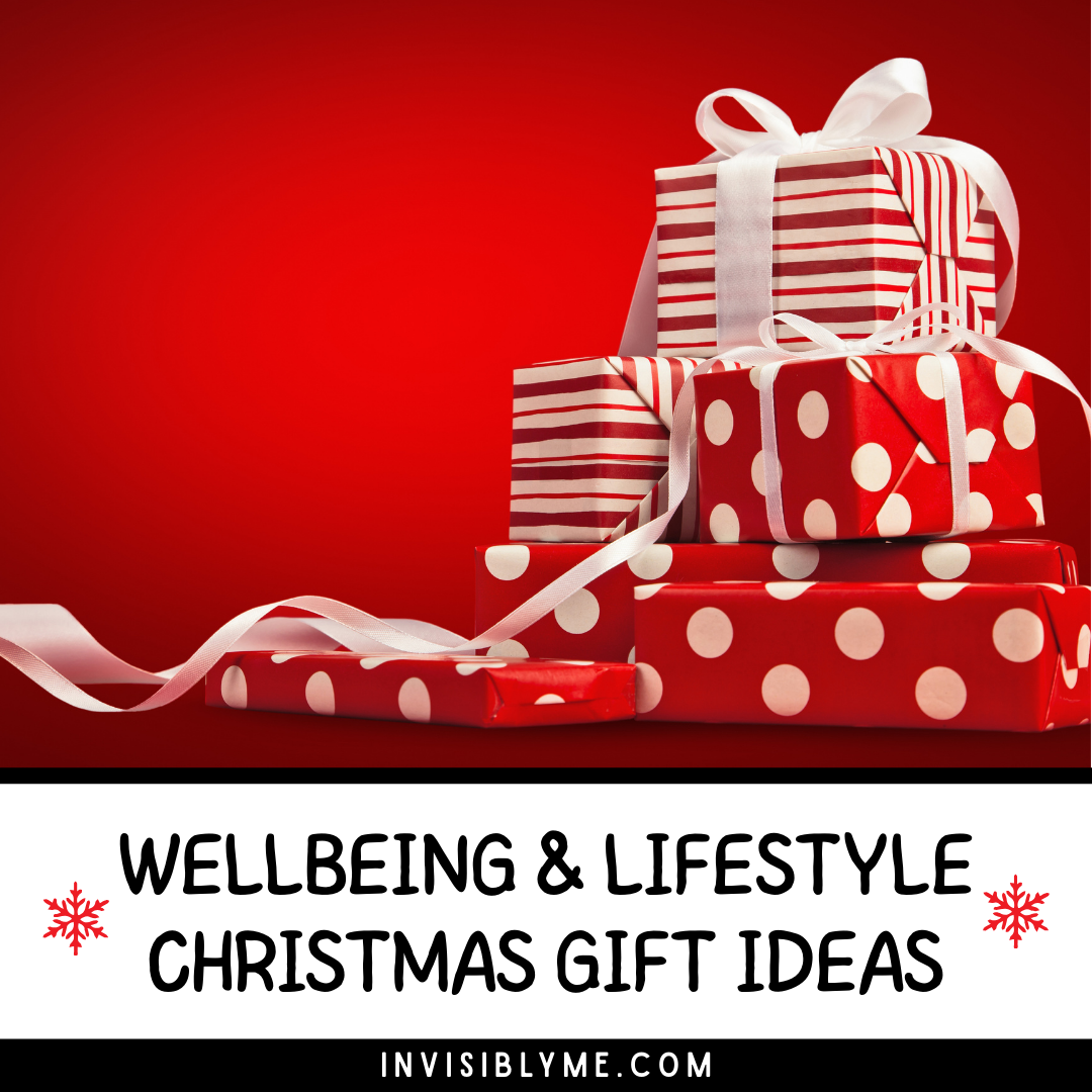 Several Christmas presents are stacked up, wrapped in red and white spotty and striped paper with white ribbons. Below is the blog post title: Wellbeing and lifestyle Christmas gift ideas.